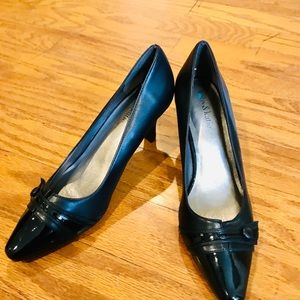 Black leather with patent leather toe. Never worn.